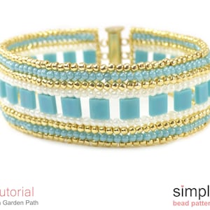 May include: A turquoise and gold beaded bracelet with a clasp fastening. The bracelet features a pattern of turquoise square beads and gold round beads.