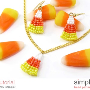 May include: A gold chain necklace with a beaded candy corn pendant and matching earrings. The necklace and earrings are made with white, orange, and yellow beads. The image also includes several candy corn pieces.
