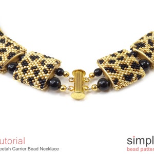 May include: Close-up of a gold and black beaded necklace with a cheetah print pattern. The necklace is made with small beads and has a gold clasp.