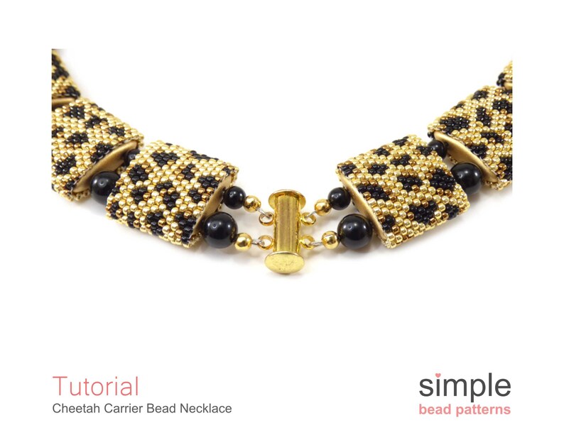 May include: Close-up of a gold and black beaded necklace with a cheetah print pattern. The necklace is made with small beads and has a gold clasp.