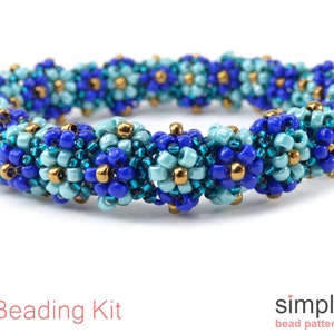 May include: A beaded bracelet with a blue, turquoise, and gold color scheme. The bracelet is made with small seed beads and has a woven pattern. The bracelet is a DIY kit.