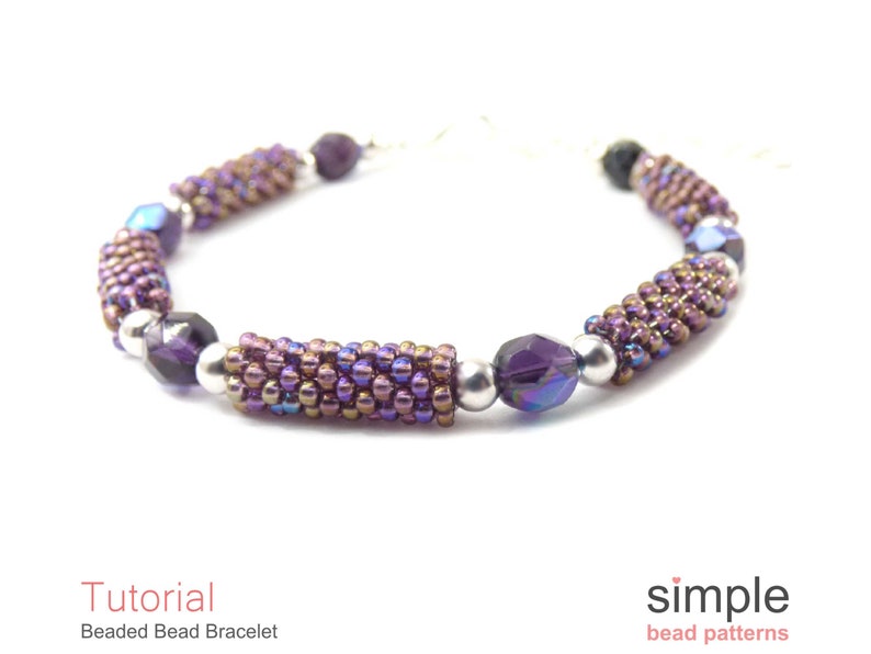 May include: A purple and silver beaded bracelet with a simple design. The bracelet is made with small seed beads and larger faceted beads. The bracelet is a great example of a simple beading project.