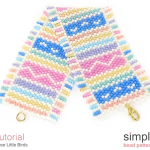 May include: A colourful beaded bracelet with a geometric pattern in shades of pink, blue, yellow, and white. The bracelet has a gold clasp.