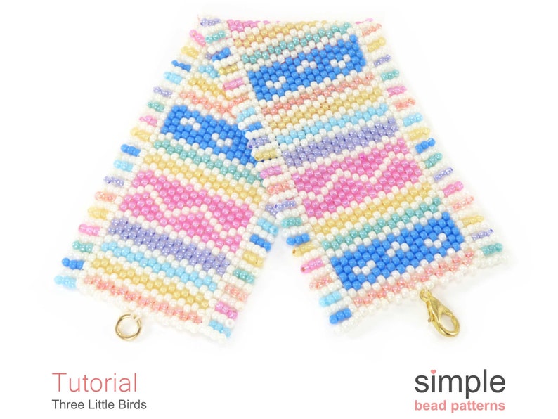 May include: A colourful beaded bracelet with a geometric pattern in shades of pink, blue, yellow, and white. The bracelet has a gold clasp.