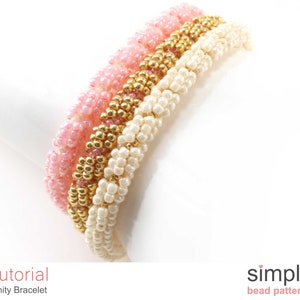 May include: A close-up of a three-strand beaded bracelet with pink, white, and gold beads. The bracelet is made with small seed beads and is a simple design.