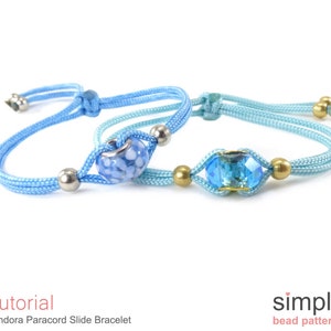 May include: Two paracord bracelets with slide beads. One bracelet is light blue with a white and blue patterned bead. The other bracelet is a darker blue with a clear blue crystal bead. The bracelets are on a white background.  Tutorial: Pandora Paracord Slide Bracelet. simple bead patterns.