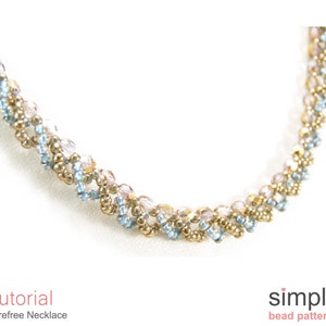 May include: A delicate necklace made of small, gold, light blue, and clear beads. The necklace has a repeating pattern and is displayed on a white background. The text "Tutorial Carefree Necklace" is visible in the image.