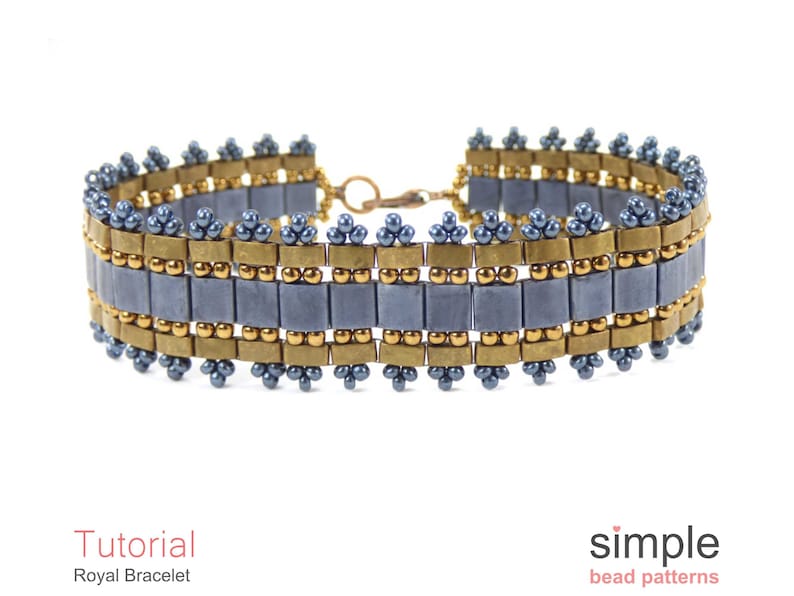 May include: A blue and gold beaded bracelet with a simple design. The bracelet is made with small, square beads and round beads. The bracelet is a great example of a simple, yet elegant design.
