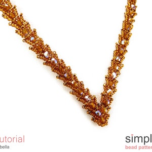 Puede incluir: Un collar de cuentas doradas con un dise&ntilde;o en forma de V. El collar est&aacute; hecho con peque&ntilde;as cuentas facetadas que crean un efecto brillante. El collar es una pieza de joyer&iacute;a simple y elegante.