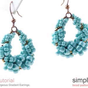 May include: A pair of turquoise gradient beaded earrings with gold accents. The earrings are made with small, round beads and have a teardrop shape. The earrings are hanging from gold hooks.