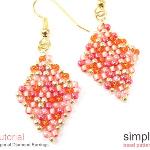 May include: A pair of gold beaded earrings with a diagonal diamond shape. The beads are in shades of pink, orange, and gold. The earrings are hanging from gold hooks.