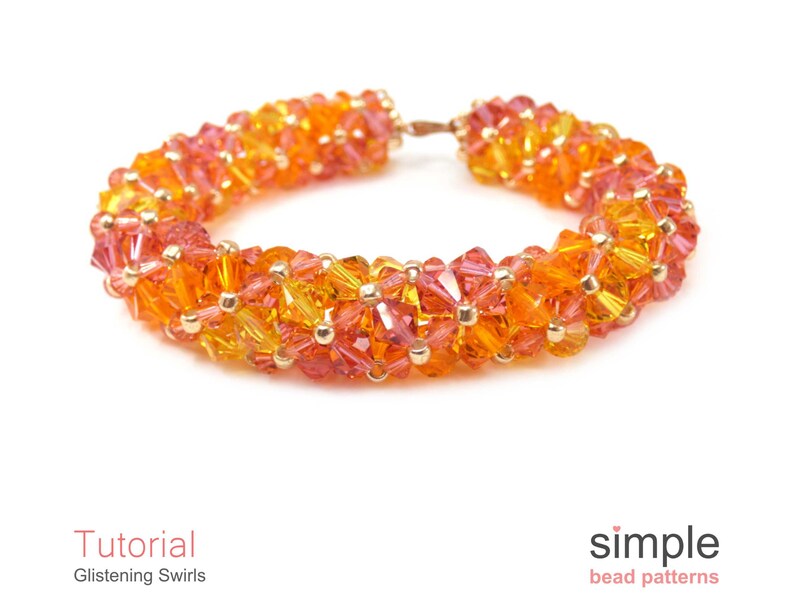 May include: A close-up of a beaded bracelet with a gradient of orange, yellow, and red beads. The bracelet is made with small, faceted beads and has a simple, elegant design.