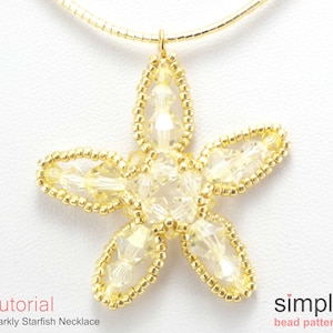 May include: A gold chain necklace with a sparkly starfish pendant made of clear beads and gold wire. The pendant is about 2 inches in diameter. The necklace is a simple bead pattern.