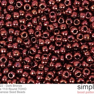 May include: A close-up image of a pile of dark bronze 11/0 size round TOHO Japanese seed beads. #222 - Dark Bronze
