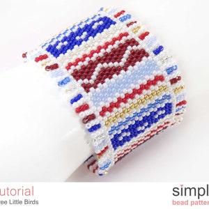 May include: A beaded bracelet featuring a geometric pattern in red, white and blue. The bracelet is made with small seed beads and has a simple design.