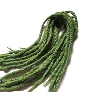 May include: A bundle of green wool dreadlocks, perfect for adding a pop of color to your hair.