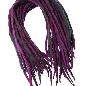 May include: A bundle of purple, green, and black wool dreadlocks.