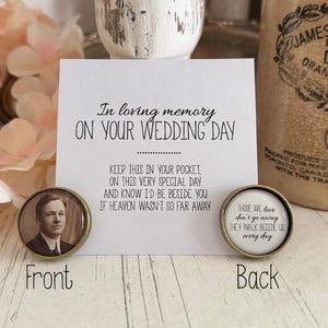 May include: Two small round memorial keepsakes with a gold rim. The front features a black and white photo of a man in a suit. The back has a white background with the text "Those we love don't go away they walk beside us every day".