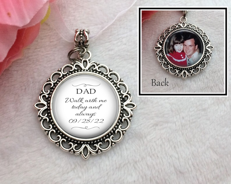 May include: Silver charm with a white background and black text that reads "DAD Walk with me today and always 09/28/22". The back of the charm has a photo of a man and a girl.