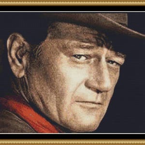 Peut inclure: Un portrait rapproché d'un homme avec une expression sérieuse. Il porte un chapeau brun et une écharpe rouge. L'arrière-plan est sombre.