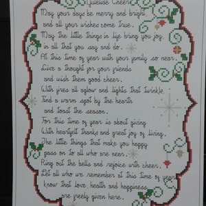 May include: A white card with a red and green border featuring a Christmas poem. The poem reads: "Juletide Cheer May your days be merry and bright. and all your wishes come true. May the little things in life bring you joy. in all that you say and do. At this time of year with your family so near. Give a thought for your friends and wish them good cheer. With fires all aglow and lights that twinkle. Find a warm spot by the hearth and toast the season. For this time of year is about giving. With heartfelt thanks and great joy of living. The little things that make you happy pass on to all who are near. Ring out the bells and rejoice with cheer. Let all who we remember at this time of year know that love, health and happiness are freely given here."