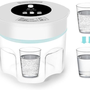 May include: White plastic food vacuum sealer with a digital timer and control panel. The sealer has a clear container with a blue lid. Two glasses of water are shown to illustrate the vacuum sealing process.