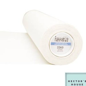 May include: A roll of white Fuse-a-Web Lite fusible interfacing fabric. The label on the roll displays the product name, the number 2263, and other details. The fabric is unrolled, showing a flat, white surface.