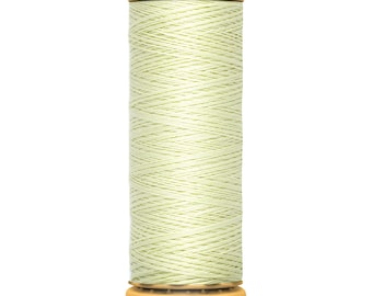 May include: A spool of pale green Gütermann thread. The spool has a yellow top with the Gütermann logo and a yellow base with the text "100 m - 110 yds/vgs". The thread is tightly wound around the spool.