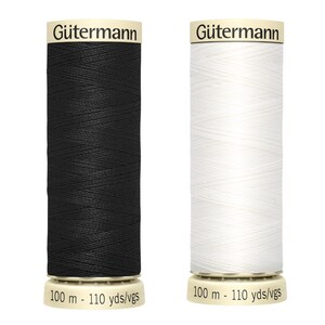 May include: Two Gütermann thread spools, one black and one white, are shown. Each spool has the Gütermann logo and reads "100 m - 110 yds/vgs". The thread is wound on a cylindrical spool. The image is set against a white backdrop.