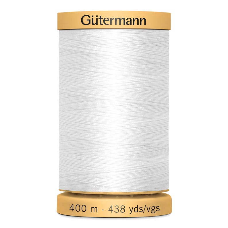 May include: A spool of white sewing thread by G&uuml;termann. The top of the spool features the brand name in black text, and the base displays the length as 400 m - 438 yds/vgs. The thread is wound in a cross-hatch pattern around the cylindrical spool.
