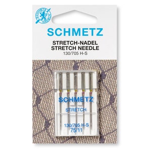 May include: A packet of SCHMETZ stretch needles, model 130/705 H-S, for sewing machines. The packaging is white and blue, featuring the SCHMETZ logo and product details. The clear plastic case inside holds several needles.