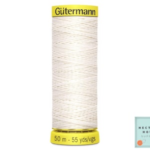 May include: A white spool of Gutermann thread with a yellow label that reads "Gutermann" and "50 m - 55 yds/vgs".