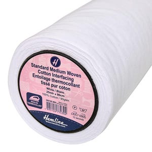 May include: A roll of white cotton interfacing for sewing projects. The label reads "Standard Medium Woven Cotton Interfacing", "Entoilage thermocollant tissé pur coton", "White/Blanc", "25mtr x 90cm", "100% Cotton/90gsm", "HN100.WH", "Made in China", "Hemline", "www.hemline.com", and "12 seconds".