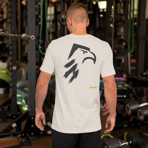 No Comment Eagle T-Shirt - Abstract Animal Back Print, Gold Graffiti Tag, Minimalist White Unisex Tee