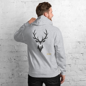 May include: A light gray hooded sweatshirt featuring a black graphic of a deer head with antlers on the back. The text "No Comment" is printed in small yellow letters below the deer graphic. The hoodie has long sleeves and a hood.