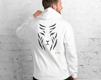 May include: A white hooded sweatshirt featuring a black graphic print on the back that resembles a stylized tiger face composed of abstract stripes. The text No Comment is printed in small yellow letters below the graphic design.