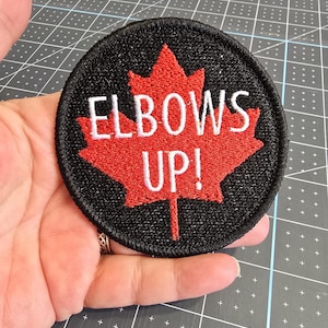 Elbows Up!  Coudes Levés!  Iron-On Patch, Canadian Embroidered Patch