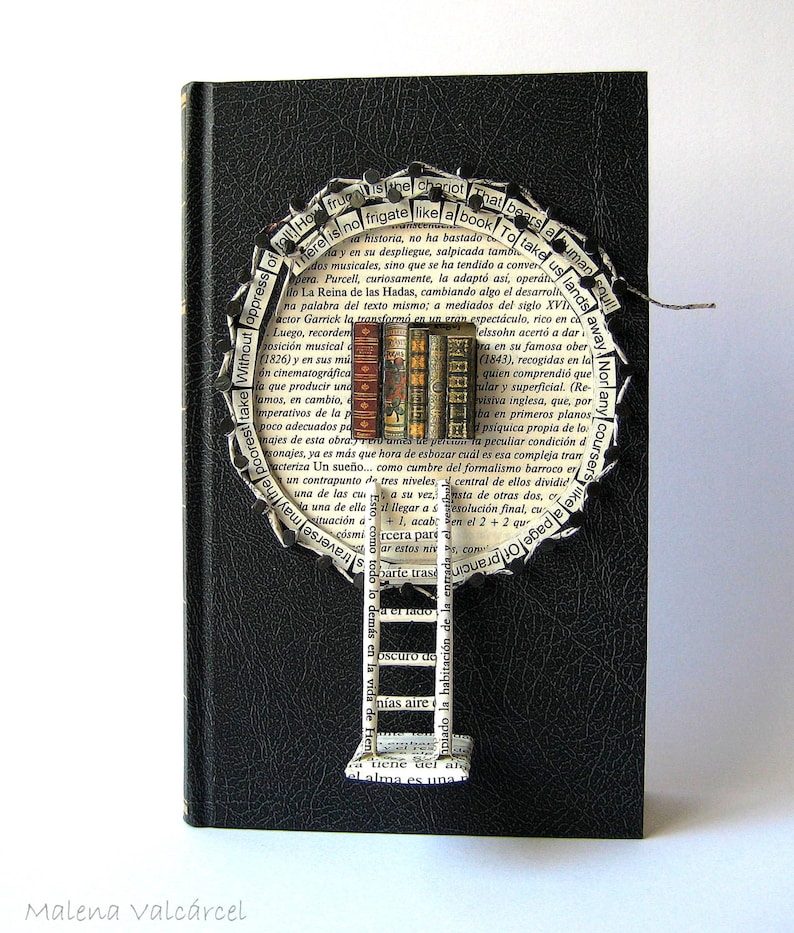 May include: A black book with a circular design made of torn pages. The design features a ladder leading up to a tree with books as leaves. The text on the pages reads "There is no frigate like a book to take us lands away." and "Human soul!"