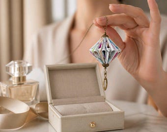 Origami-boekketting: miniatuur papieren kunstsieraden