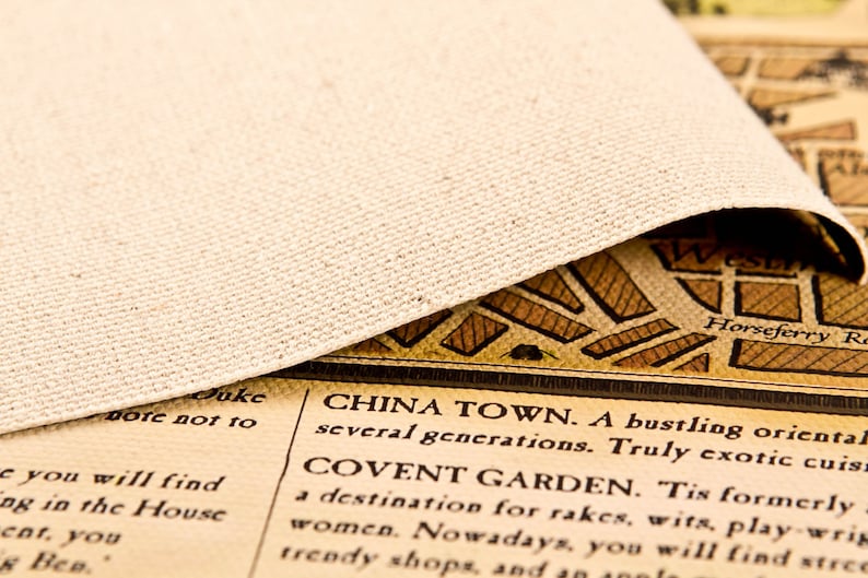May include: A close-up of a vintage map with text that reads "China Town. A bustling oriental several generations. Truly exotic cuisine" and "Covent Garden. Tis formerly a destination for rakes, wits, play-writing women. Nowadays, you will find street trendy shops, and an 1000le"