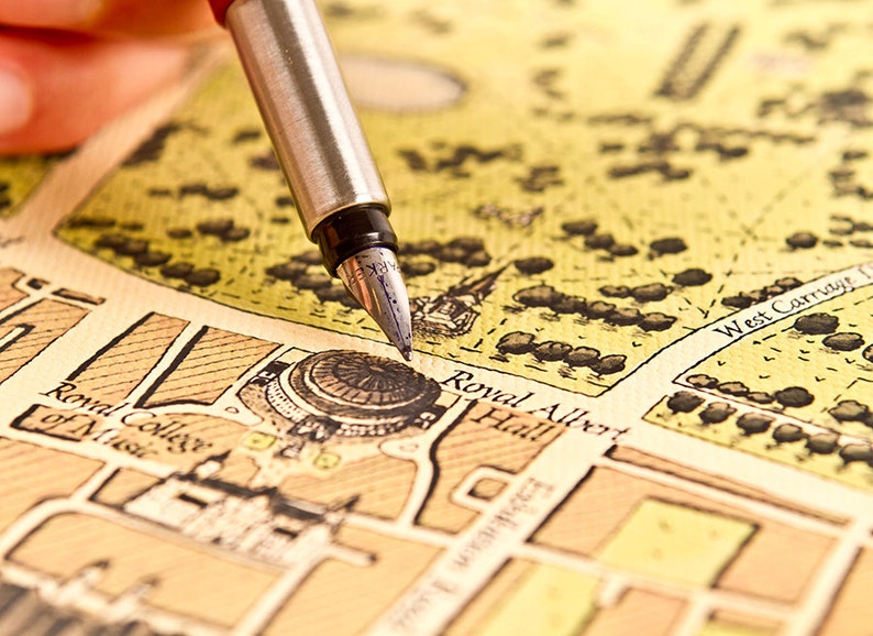 May include: A close-up of a vintage map with a fountain pen pointing to the location of "Royal Albert Hall".