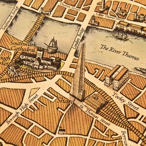 May include: A vintage-style map of London, England, with a focus on the Southwark area. The map features landmarks like Shakespeare's Globe, Southwark Cathedral, and the Shard. The River Thames is also depicted, along with several bridges.