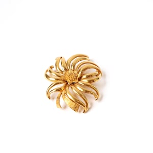 Broche vintage de flores en tono dorado