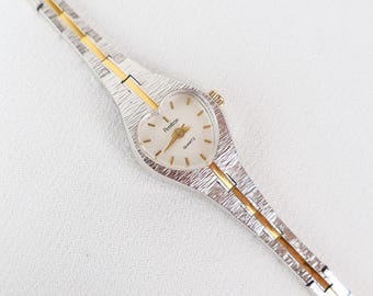 Reloj Amitron vintage bicolor con esfera en forma de corazón.