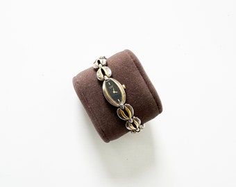 Vintage zweifarbige Armbanduhr mit geflochtenem Band und schwarzem Ziffernblatt | Bürger