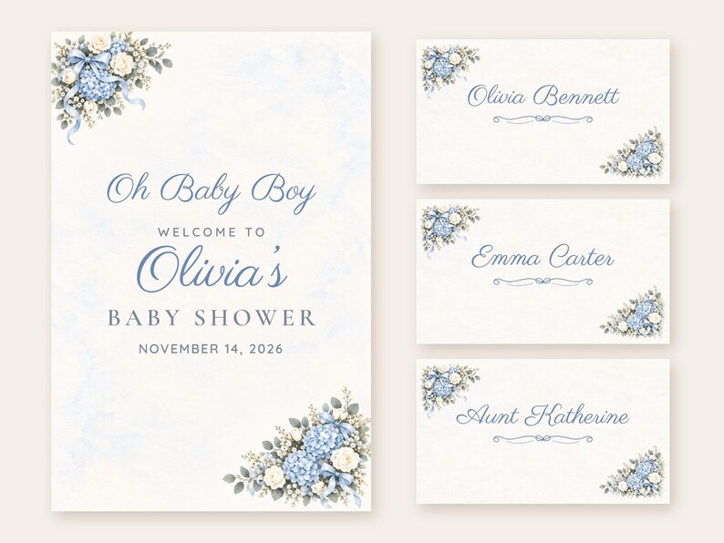 May include: A baby shower welcome sign and three place cards featuring blue hydrangea and white rose floral arrangements. The text reads Oh Baby Boy Welcome to Olivia's Baby Shower November 14, 2026, with names Olivia Bennett, Emma Carter, and Aunt Katherine.
