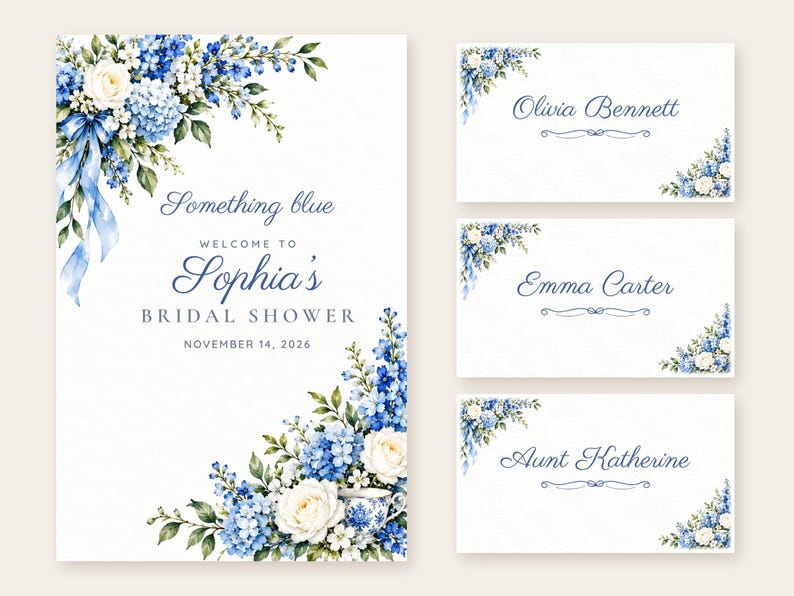 May include: A bridal shower welcome sign and three place cards featuring watercolor blue hydrangeas, white roses, and green leaves. The sign reads: Something blue, WELCOME TO Sophia's BRIDAL SHOWER, NOVEMBER 14, 2026. Place cards show names.