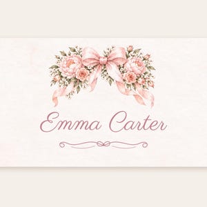 May include: A rectangular card featuring a watercolor illustration of pink peonies, roses, and green leaves tied with a soft pink ribbon. The name Emma Carter is printed in a cursive script below the floral arrangement with a decorative line.