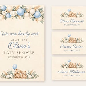 May include: A baby shower sign and three place cards featuring watercolor illustrations of teddy bears, blue and cream balloons, and floral arrangements. The text reads: We can bearly wait, WELCOME TO Olivia's BABY SHOWER, NOVEMBER 14, 2026, Olivia Bennett, Emma Carter, and Aunt Katherine.