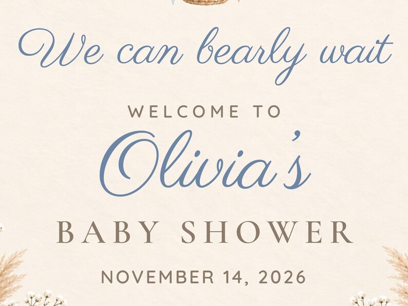 Puede incluir: Un letrero de color crema con el texto en letra cursiva azul We can bearly wait, seguido del texto WELCOME TO Olivia's BABY SHOWER y la fecha NOVEMBER 14, 2026 en letras marrones, con detalles de flores secas en las esquinas inferiores.